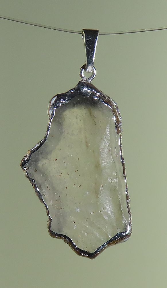 Pendants of Libyan Desert Silica Glass with silver-plated edge