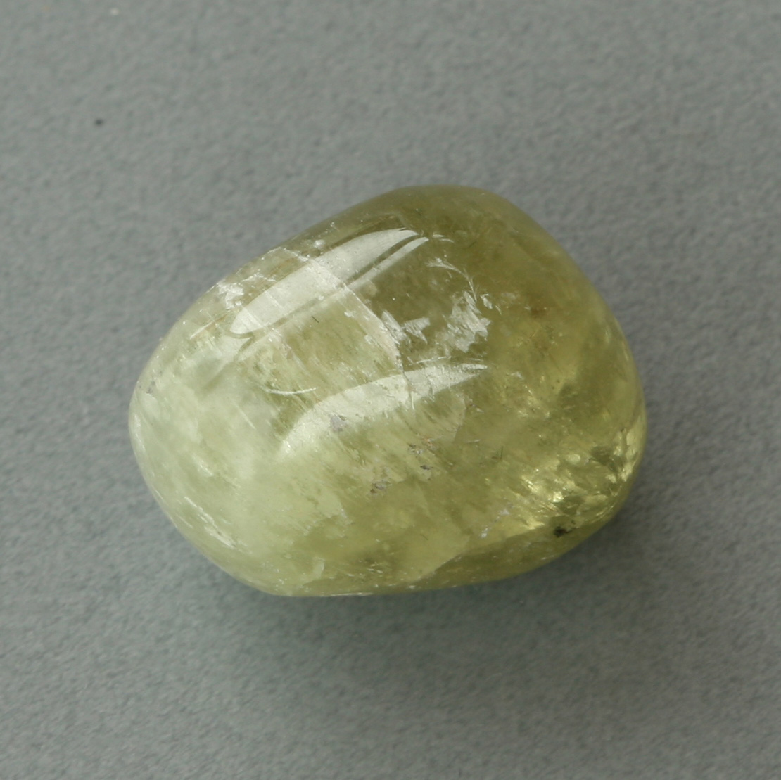 Hiddenite, hand-polished