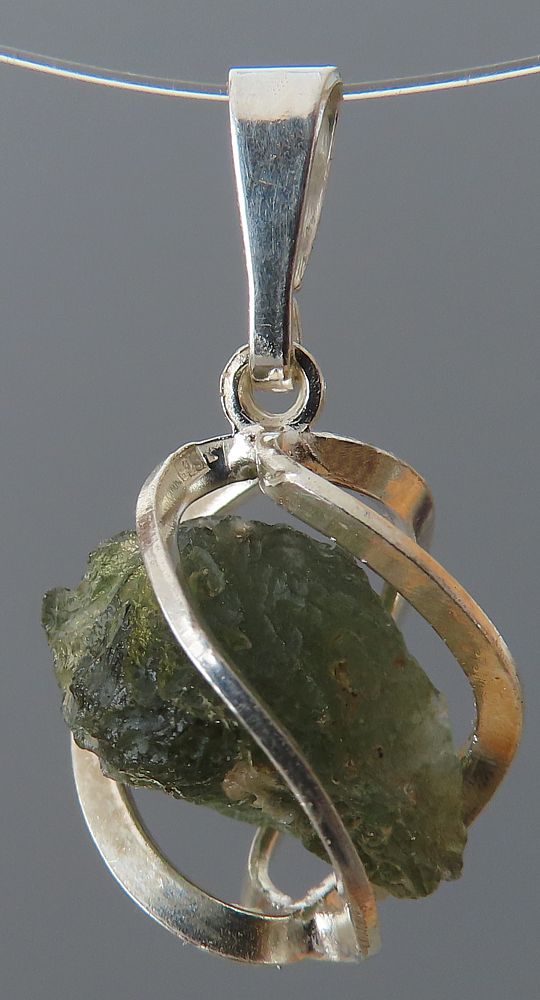 Moldavite pendant in a silver cage