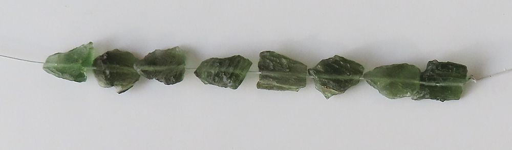 String of drilled Moldavites