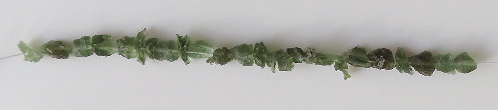 String of drilled Moldavites
