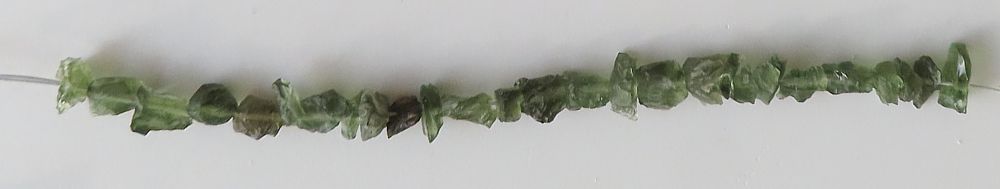 String of drilled Moldavites
