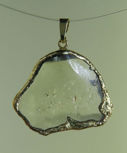 Pendants of Libyan Desert Silica Glass with gold-plated edge