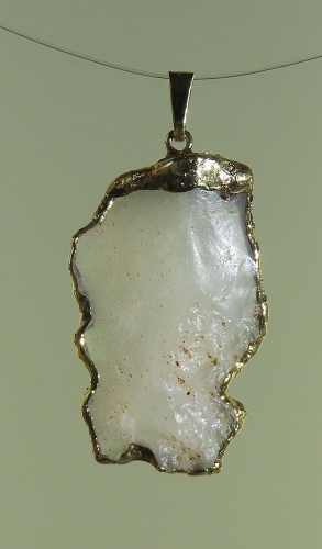 Pendants of Libyan Desert Silica Glass with gold-plated edge