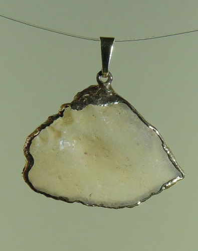 Pendants of Libyan Desert Silica Glass with gold-plated edge