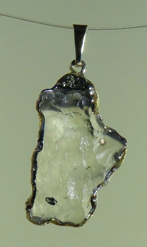 Pendants of Libyan Desert Silica Glass with gold-plated edge