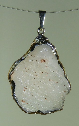 Pendants of Libyan Desert Silica Glass with gold-plated edge