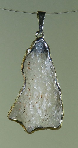 Pendants of Libyan Desert Silica Glass with gold-plated edge