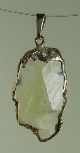 Pendants of Libyan Desert Silica Glass with gold-plated edge