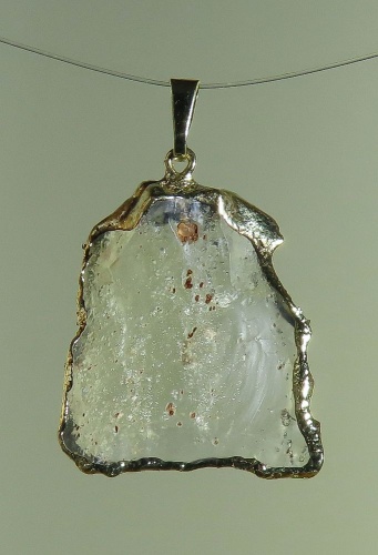 Pendants of Libyan Desert Silica Glass with gold-plated edge