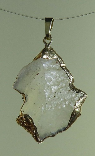 Pendants of Libyan Desert Silica Glass with gold-plated edge