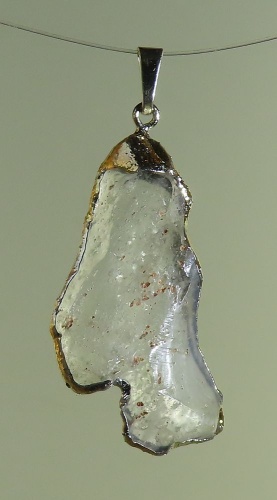 Pendants of Libyan Desert Silica Glass with gold-plated edge