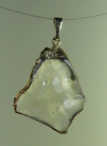 Pendants of Libyan Desert Silica Glass with gold-plated edge