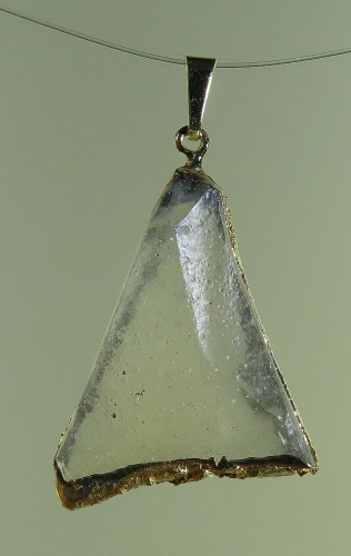 Pendants of Libyan Desert Silica Glass with gold-plated edge