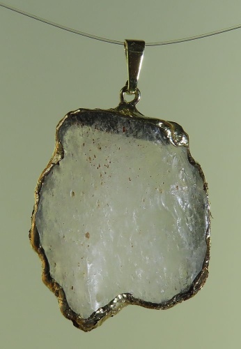Pendants of Libyan Desert Silica Glass with gold-plated edge