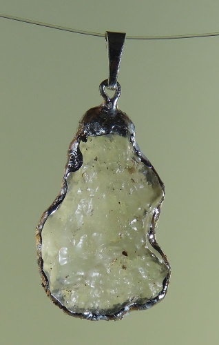 Pendants of Libyan Desert Silica Glass with silver-plated edge