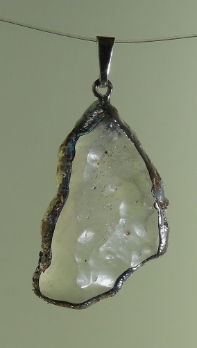 Pendants of Libyan Desert Silica Glass with silver-plated edge
