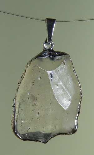 Pendants of Libyan Desert Silica Glass with silver-plated edge