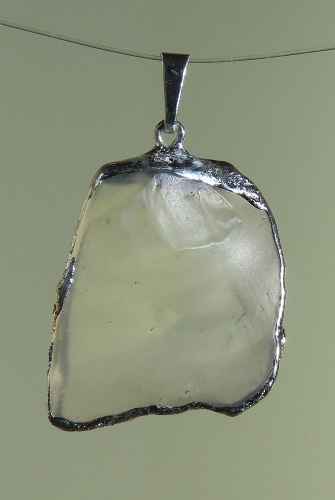 Pendants of Libyan Desert Silica Glass with silver-plated edge