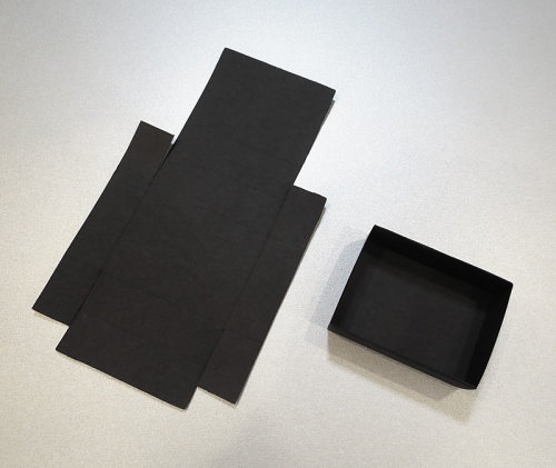 Folded boxes, black, 18 for 1 flat