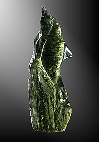 Moldavite, dolphin on rock