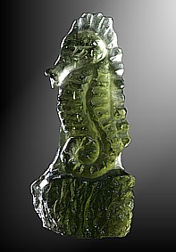 Moldavite, seahorse on rock