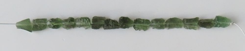 String of drilled Moldavites