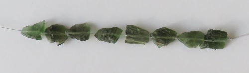 String of drilled Moldavites