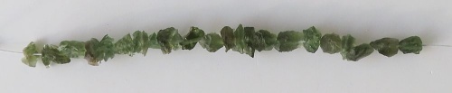 String of drilled Moldavites