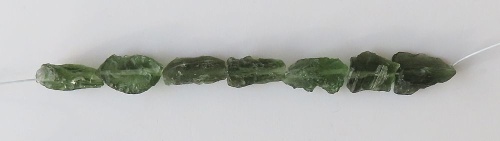 String of drilled Moldavites